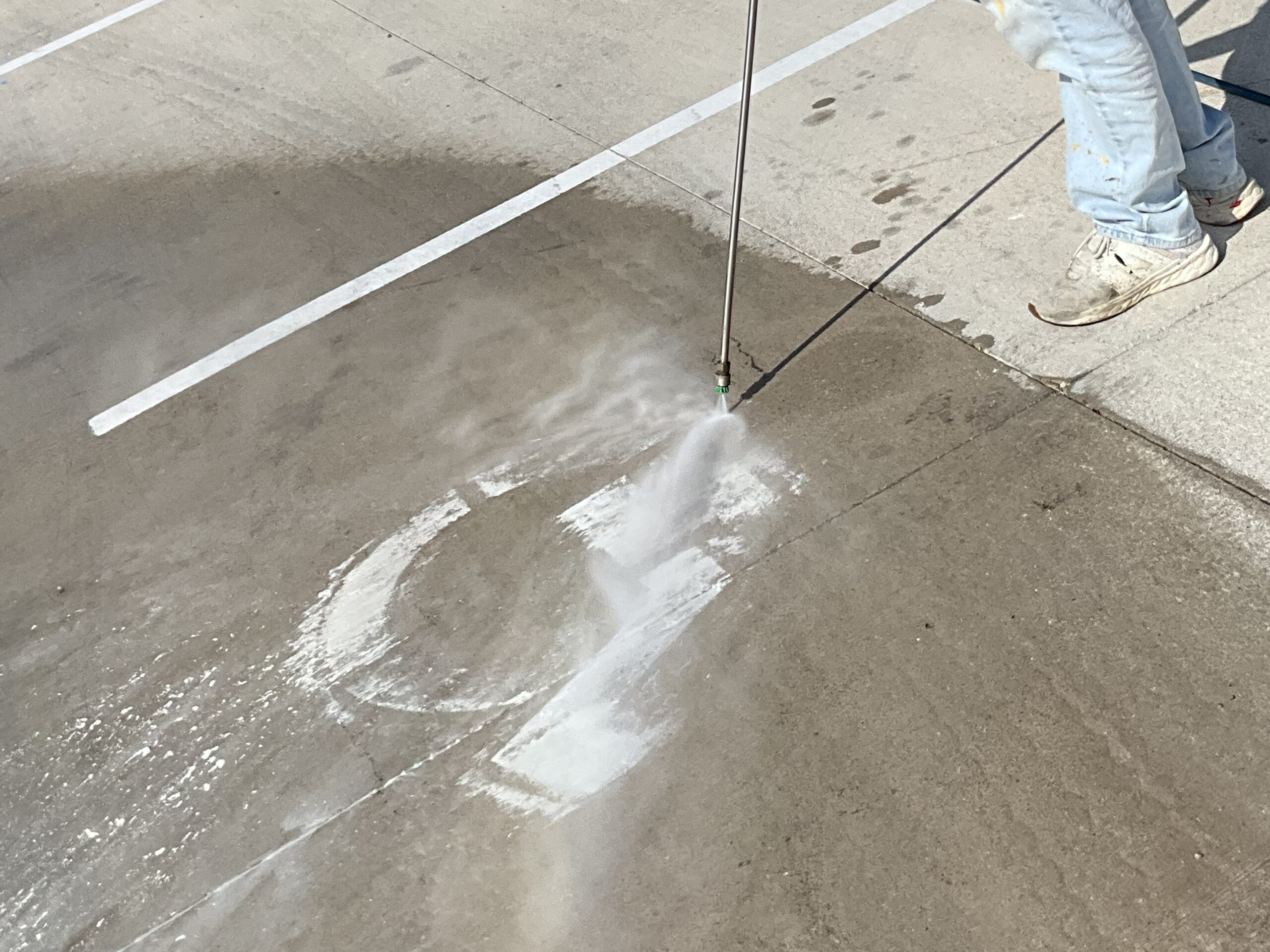 Parking lot concrete paint stripping K5 Services Company
